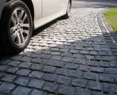 SPECKLED GREY GRANITE SETTS COMPLIMENT SIMONS BMW IN WESTHOUGHTON