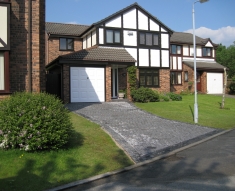 SPECKLED GREY GRANITE SETTS COMPLIMENT SIMONS BMW IN WESTHOUGHTON