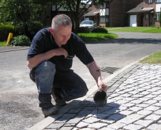 SPECKLED GREY GRANITE SETTS COMPLIMENT SIMONS BMW IN WESTHOUGHTON