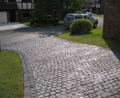 SPECKLED GREY GRANITE SETTS COMPLIMENT SIMONS BMW IN WESTHOUGHTON