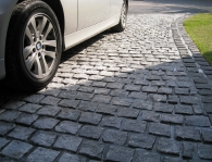 SPECKLED GREY GRANITE SETTS COMPLIMENT SIMONS BMW IN WESTHOUGHTON